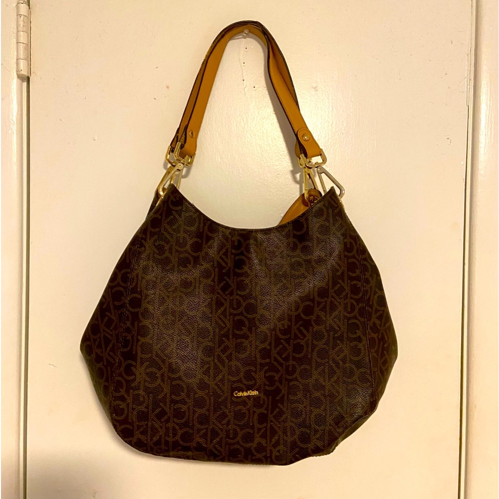 Large Calvin Klein Handbag. Medium Size Tear on Inside Liner and Handle Damage.